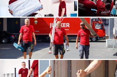 Team von Umzugshelfern in roter Arbeitskleidung bei Vorbereitung, Tragen von Werkzeugen und gegenseitiger Unterstützung während eines Umzugs