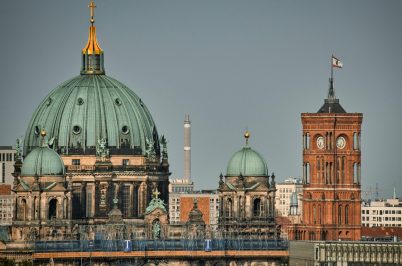 Captivating view of Berlin Cathedral and Red Town Hall in Germany, showcasing urban architectural beauty.